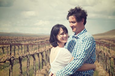 Purple Star Winery's owners pose on their winery's property.